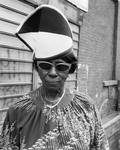 © Dawoud Bey - A Woman at Fulton Street and Washington Ave, 1989 - Archival inkjet photograph. 2018 print. Edition 2/4. Signed in pen by artist on label verso.