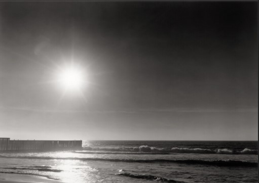 Looking into the sun- Late afternoon, The California/Mexico Border Fence -  The End The North Pacific Ocean The Sun is the bullet border field state park Tijuana River valley beach, San Diego County, California, USA, Thomas Joshua Cooper, 2018, Courtesy of LACMA
