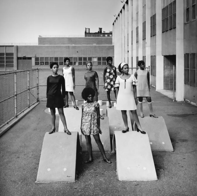 An AJASS-associated modelling group in Harlem, circa 1966, by Kwame Brathwaite.